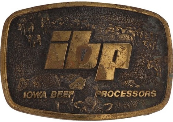 A worn brass belt buckle stamped ibp, Iowa Beef Processors